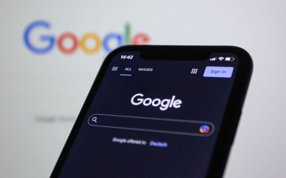 Person searching on Google on a smartphone, where AI Overviews now appear above the traditional results