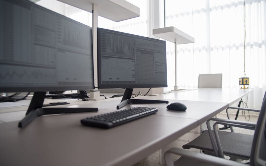 Empty office desk with a computer monitor displaying a page of search results
